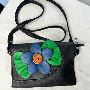 SAX Black Vegan Leather Crossbody Bag with Blue and Green Floral Accent.
